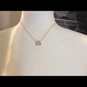 Beautiful gold astrological necklaces.